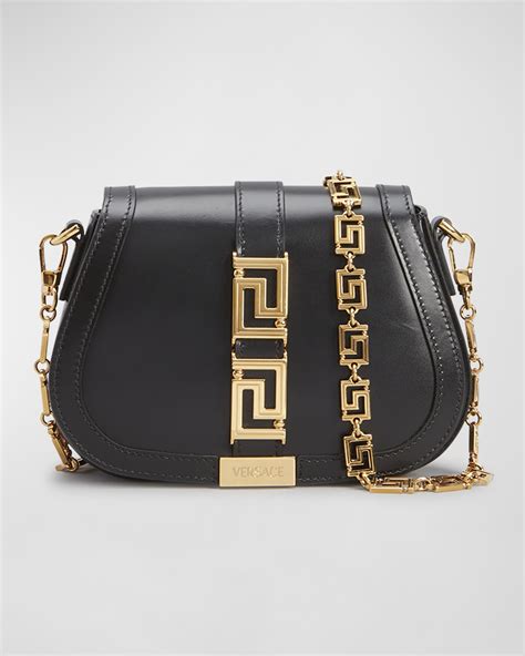 models carrying the versace greca goddess small small shoulder bag